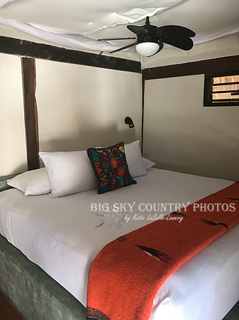 Interior view of Zamas beachfront cabana - bed, mosquito net, fan