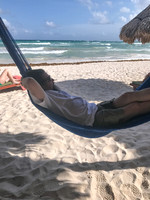 man lounging in a hammock