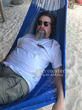 man lounging in a hammock