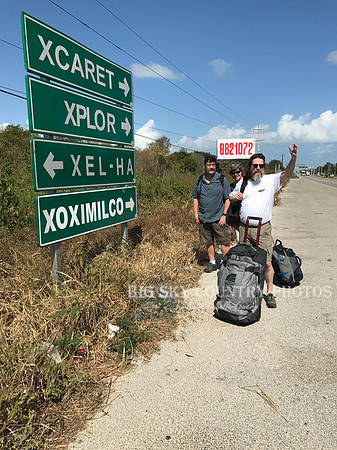 travelers standing near highway sign in the Yucatan peninsula